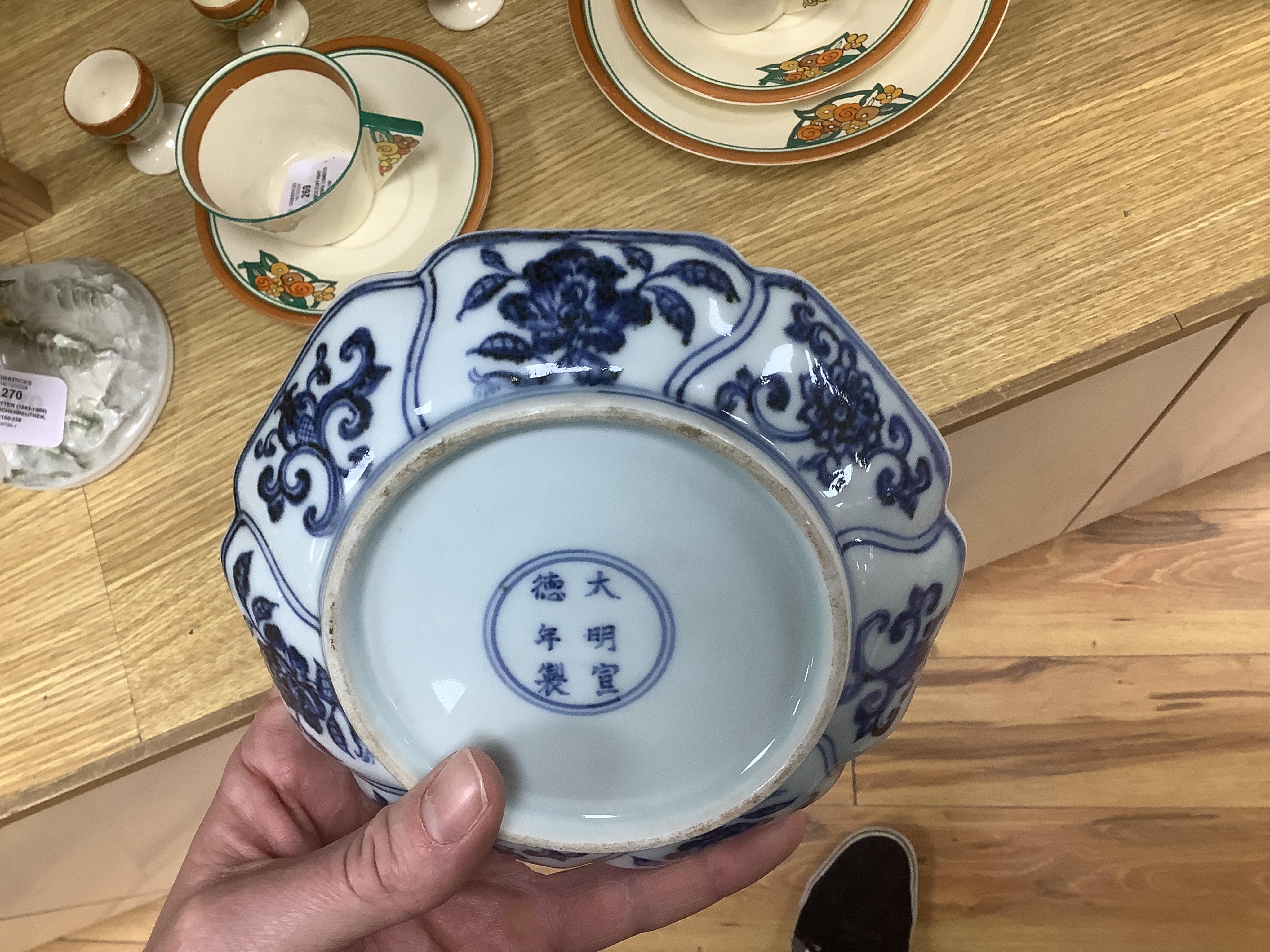 A Chinese copper red glazed dish, a blue and white bowl and a similar dish, bowl 22.5cm diameter. Condition - good